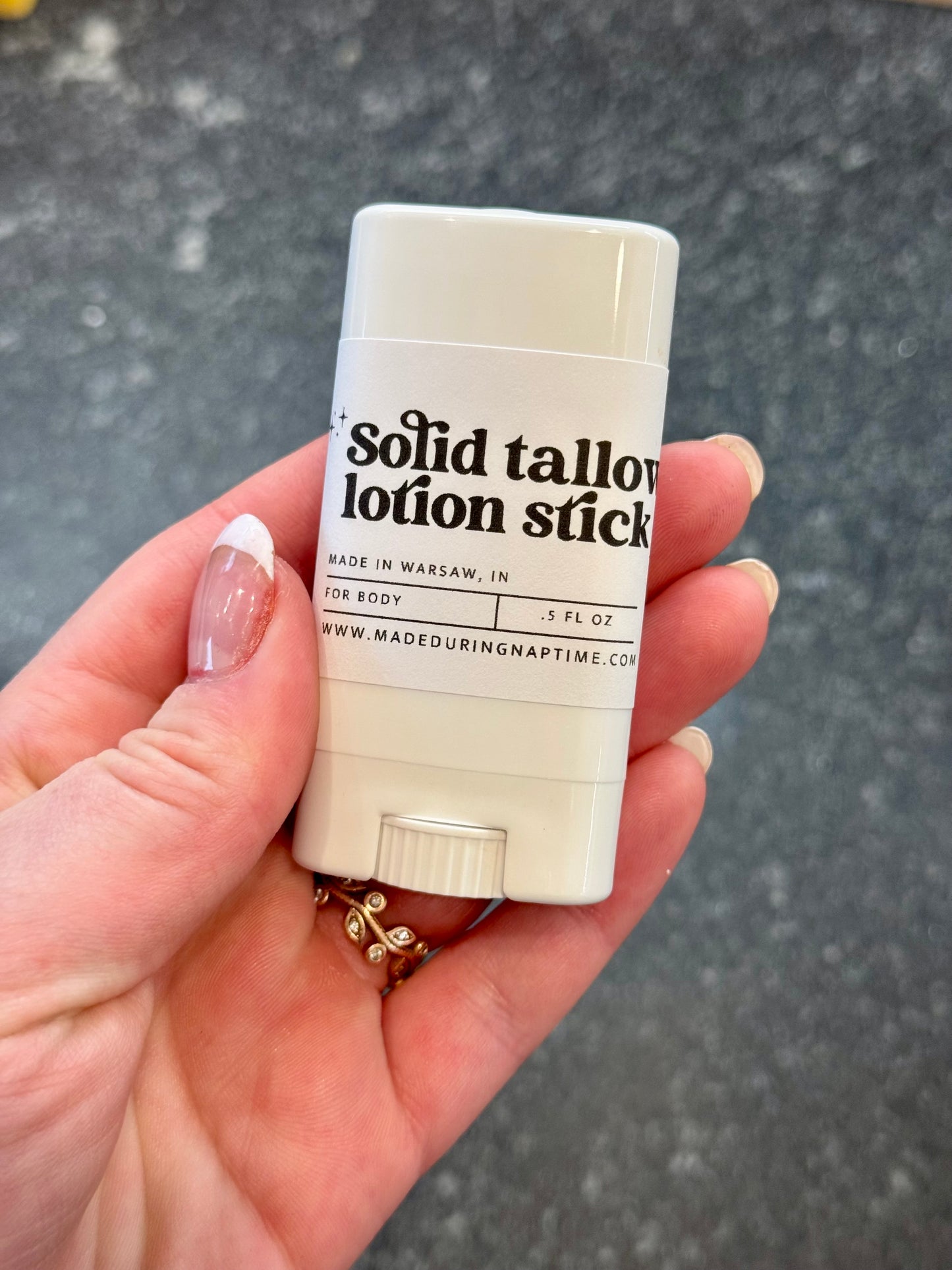 Solid tallow lotion stick